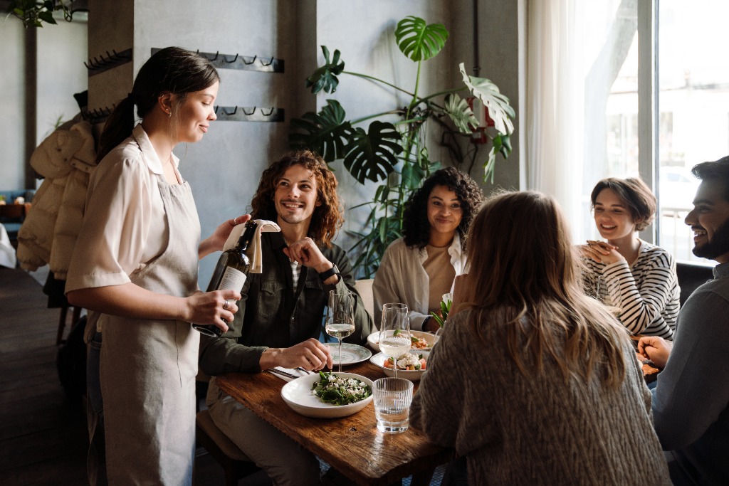 Guests enjoying premium wine and dinner service
